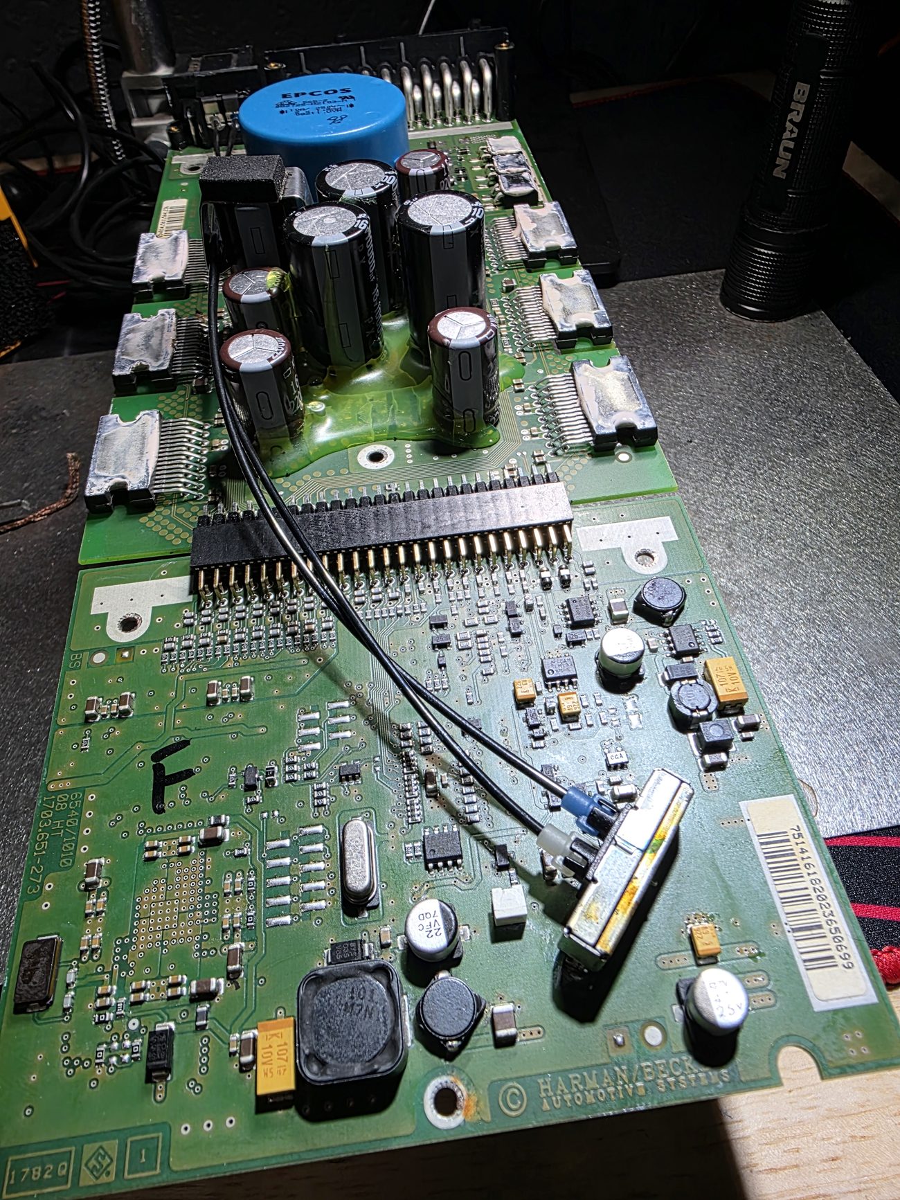 Automotive amplifier module circuit board laid out for board-level repair